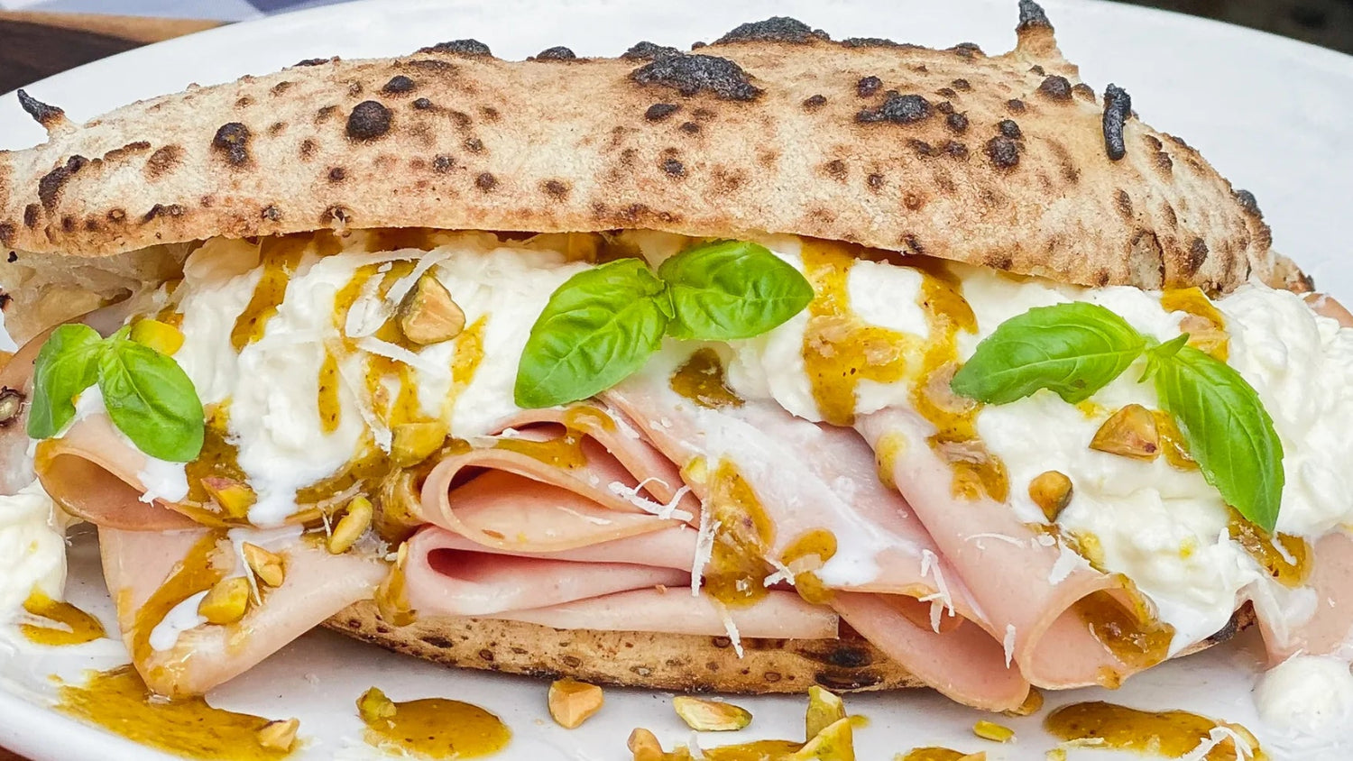 Mortadella Panuozzo with Stracciatella, Pistachio Pesto and Pecorino Romano recipe poster image